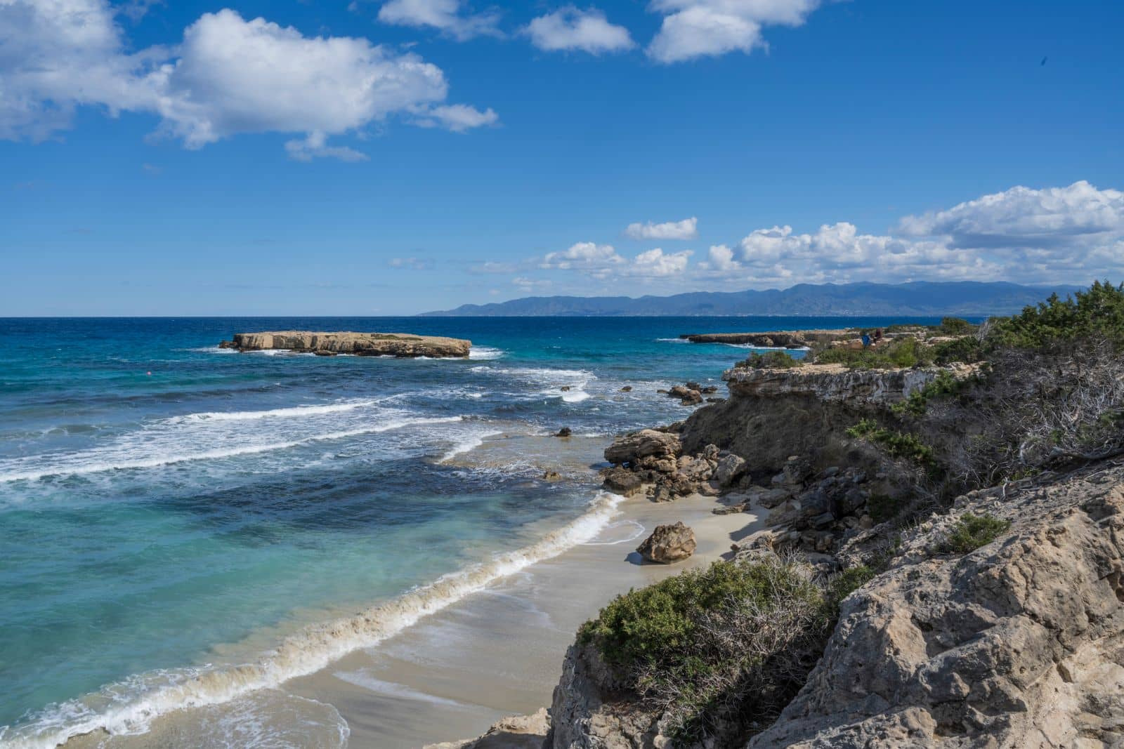 Rocky coastline and clear turquoise water on the coast of Cyprus